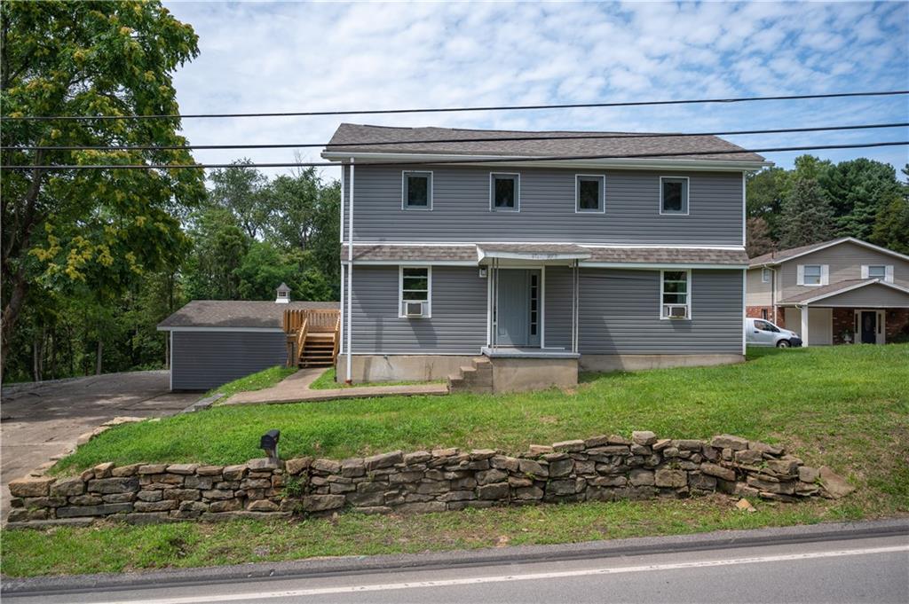 147 Highway 68 Rochester, PA 15074 - Photo 1 of 25 a front view of a house with a yard