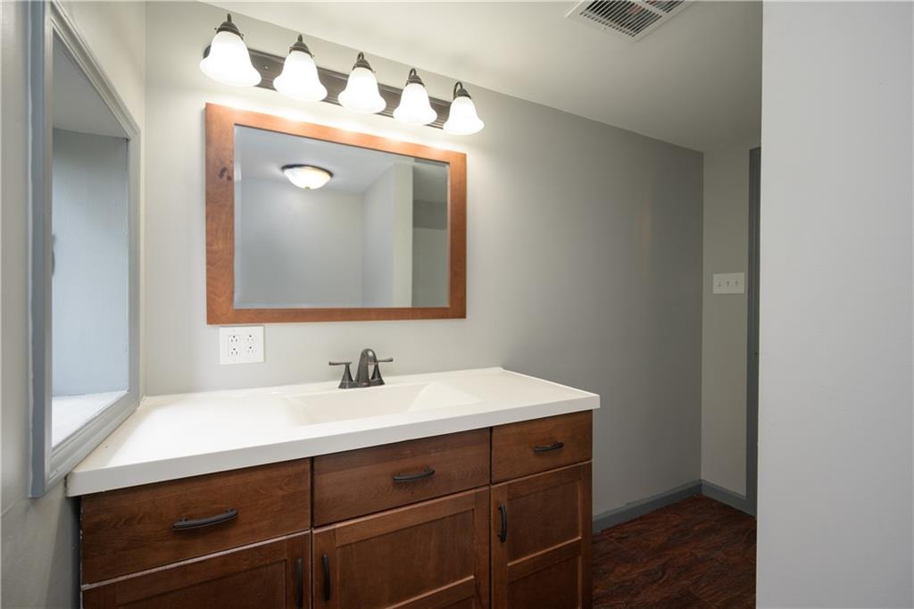 147 Highway 68 Rochester, PA 15074 - Photo 22 of 25 a bathroom with a sink and a mirror