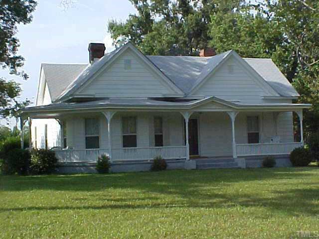4617 Cheek Road Durham, NC 27704 - Photo 1 of 1 a front view of a house with a yard