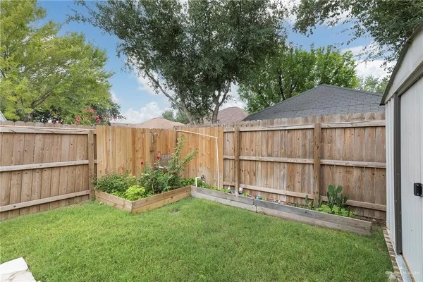 a view of a backyard with a garden