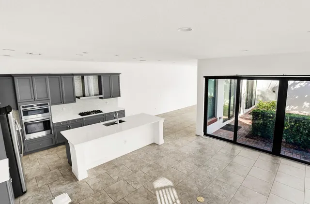 a view of a kitchen with appliances and cabinets