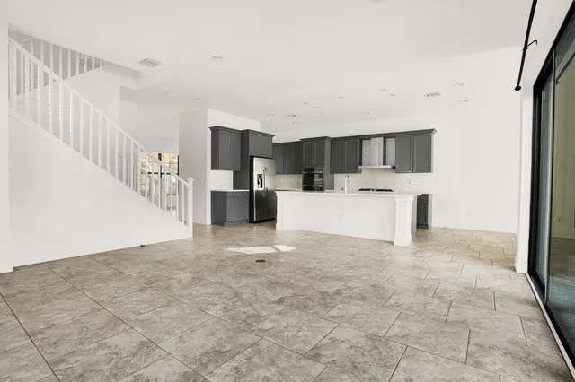 a view of a kitchen with microwave and cabinets