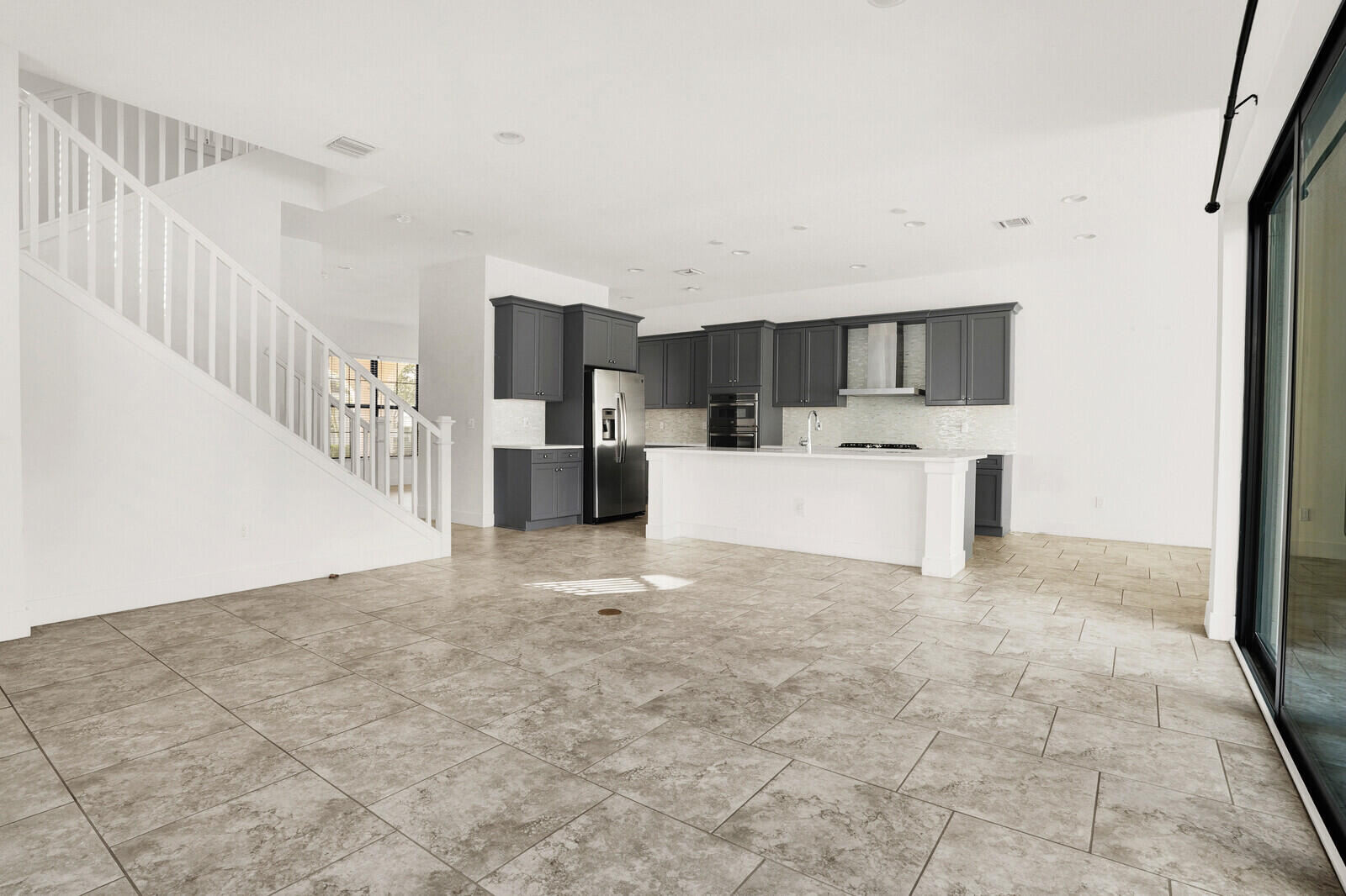13628 Dumont Road Palm Beach Gardens, FL 33418 - Photo 17 of 44 a view of a kitchen with microwave and cabinets