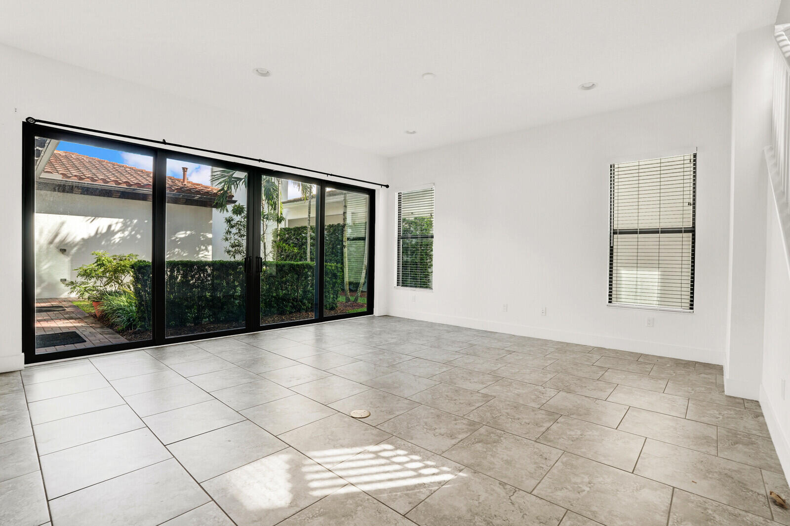 13628 Dumont Road Palm Beach Gardens, FL 33418 - Photo 19 of 44 a view of an empty room with windows