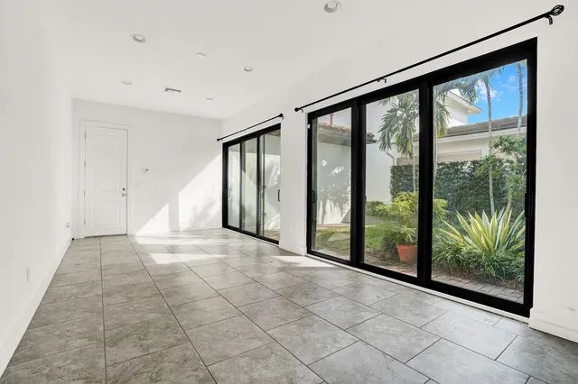 a view of an empty room with windows