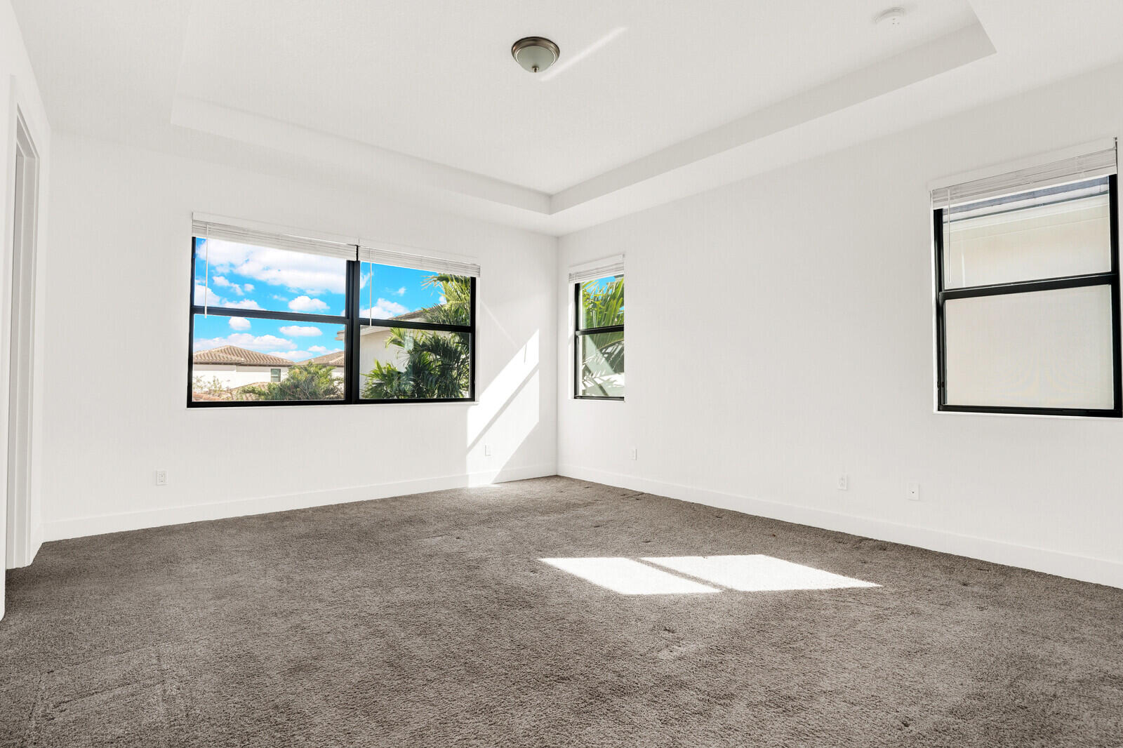 13628 Dumont Road Palm Beach Gardens, FL 33418 - Photo 23 of 44 an empty room with windows