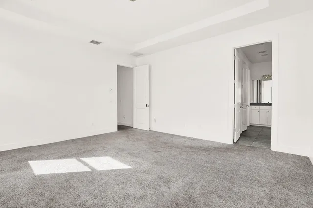 an empty room with closet area