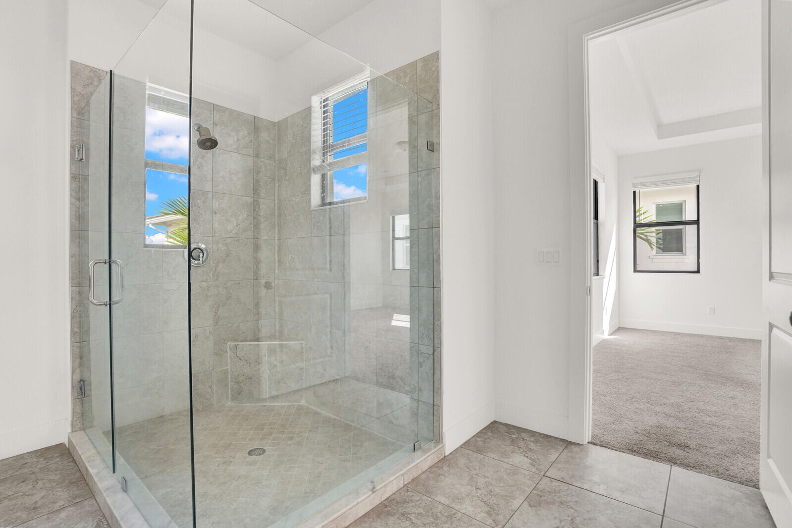 13628 Dumont Road Palm Beach Gardens, FL 33418 - Photo 28 of 44 a bathroom with a shower