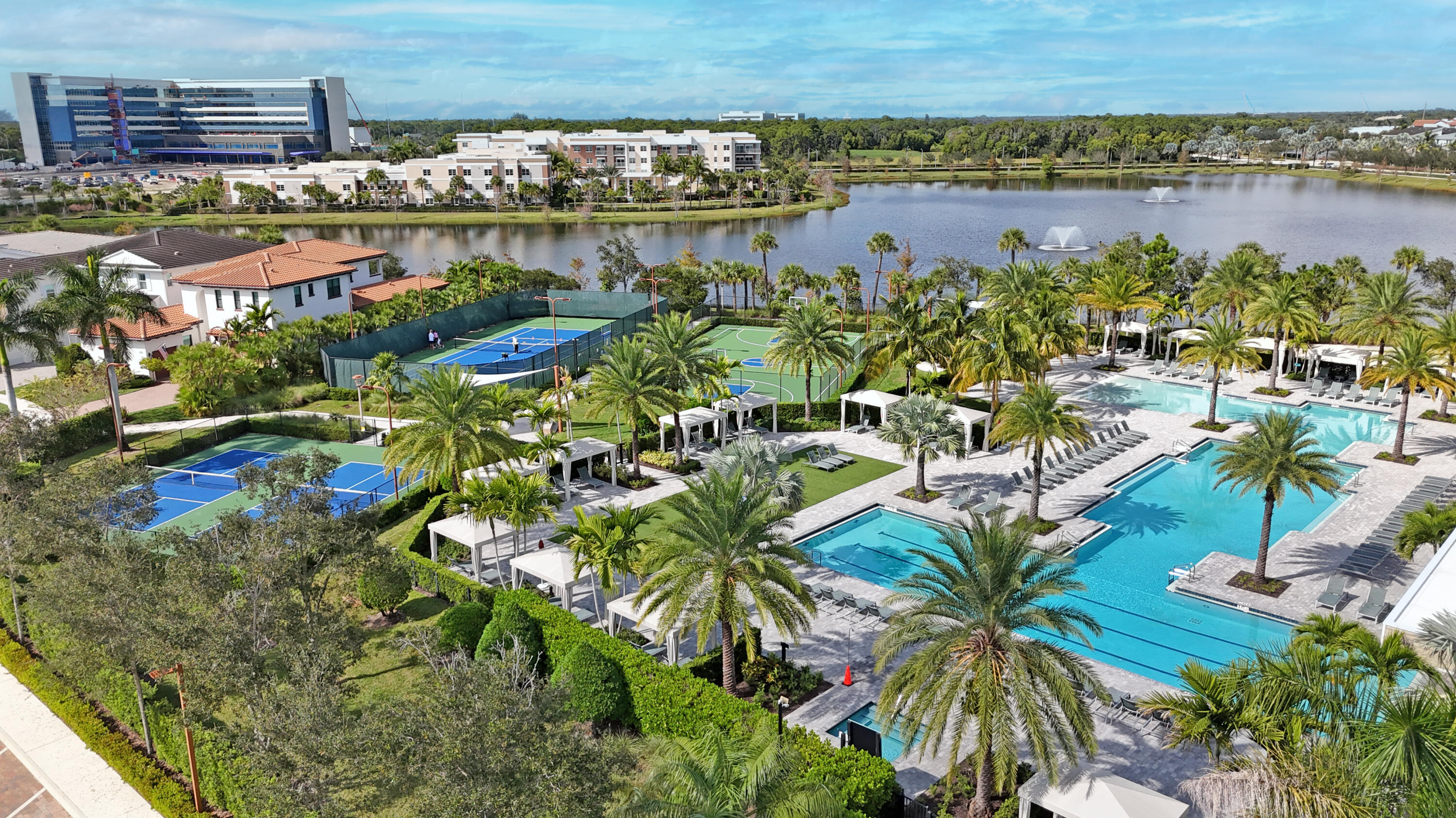 13628 Dumont Road Palm Beach Gardens, FL 33418 - Photo 40 of 44 a view of a lake with a building in the background