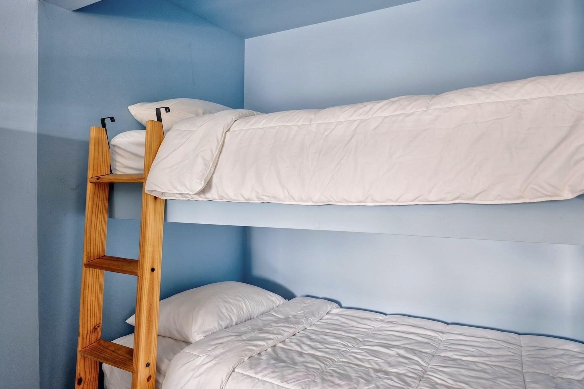 132 Shore Road, Unit 15 Truro, MA 02666 - Photo 12 of 33 a bedroom with a bed and pillows