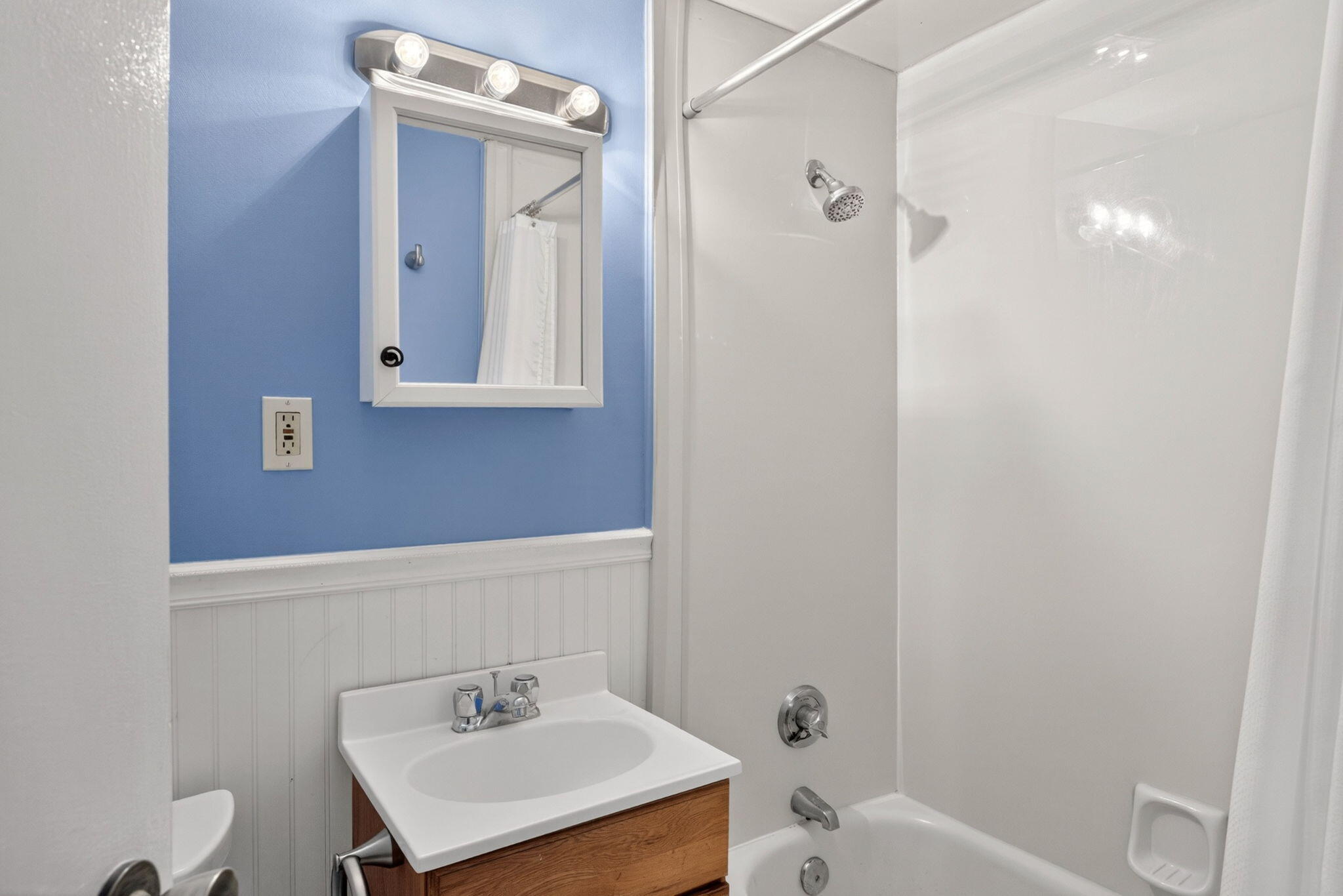 132 Shore Road, Unit 15 Truro, MA 02666 - Photo 13 of 33 a bathroom with a sink a toilet and shower