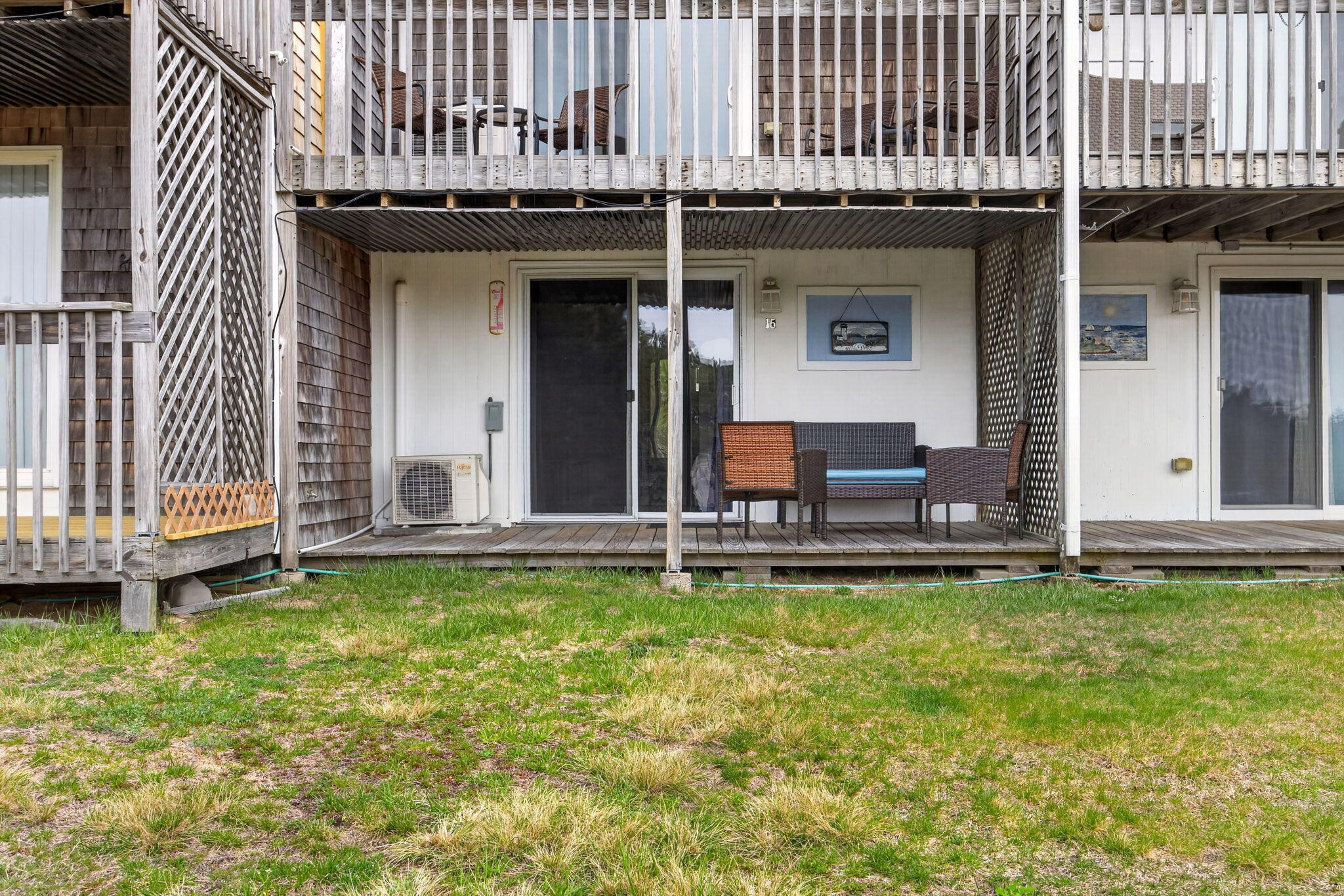 132 Shore Road, Unit 15 Truro, MA 02666 - Photo 15 of 33 a view of a patio with table and chairs and potted plants