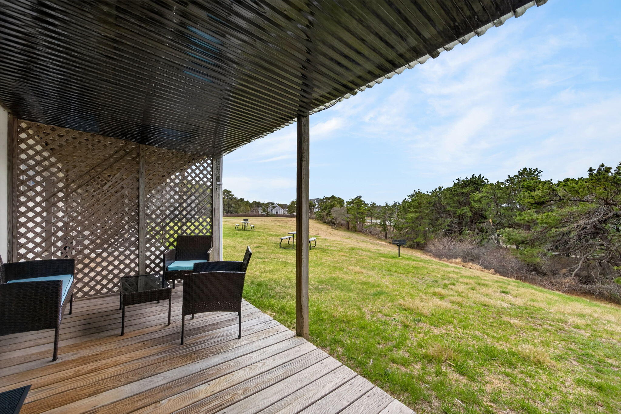132 Shore Road, Unit 15 Truro, MA 02666 - Photo 19 of 33 a view of a balcony with chair and wooden floor