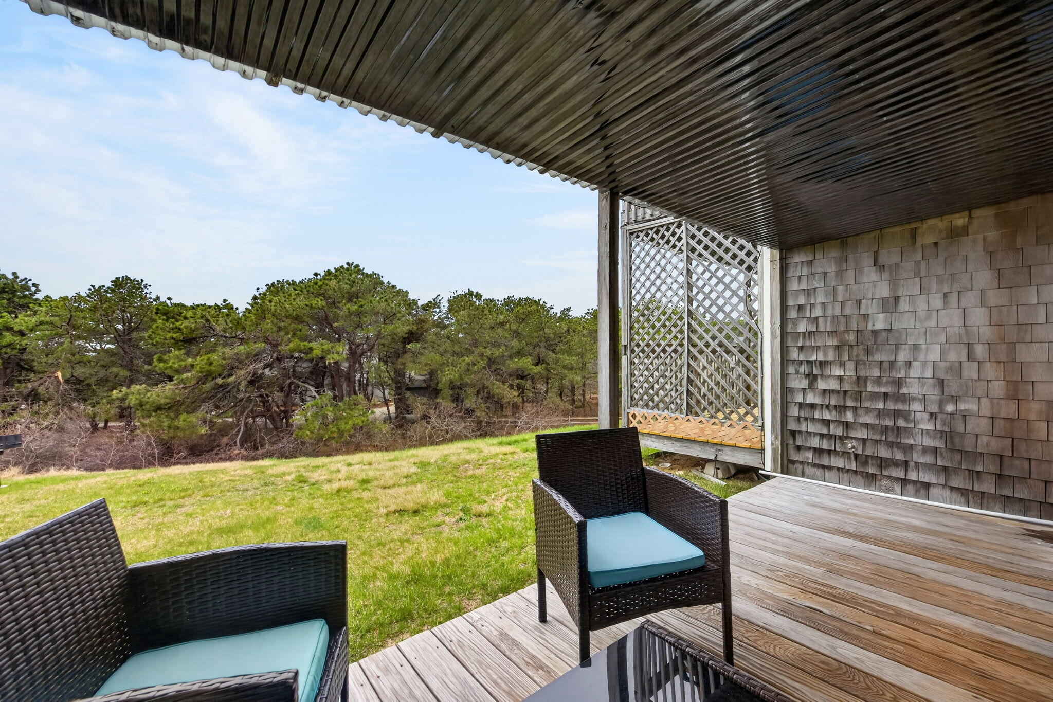 132 Shore Road, Unit 15 Truro, MA 02666 - Photo 21 of 33 a view of a chair and tables in the balcony