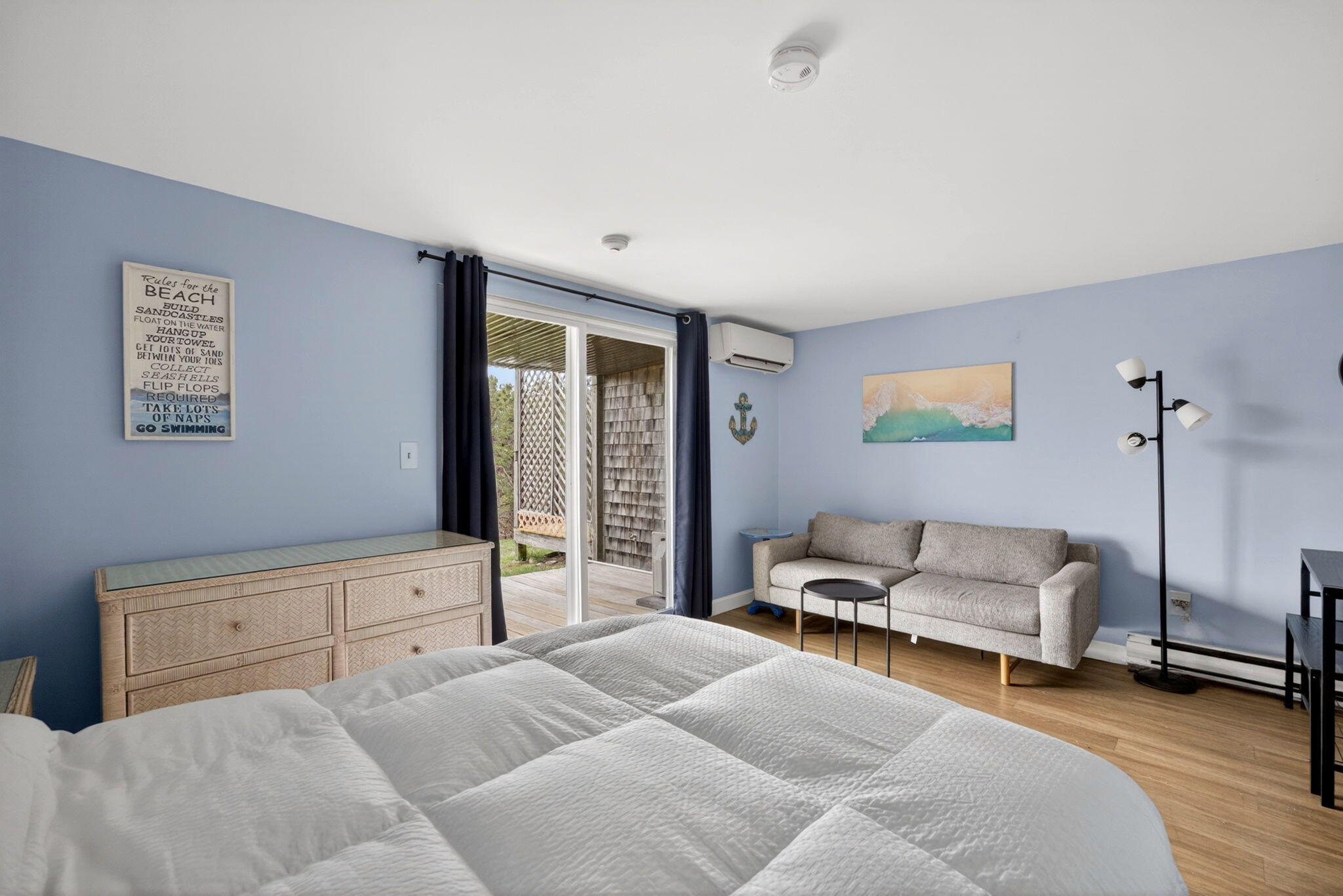 132 Shore Road, Unit 15 Truro, MA 02666 - Photo 5 of 33 a bedroom with a bed and a couch