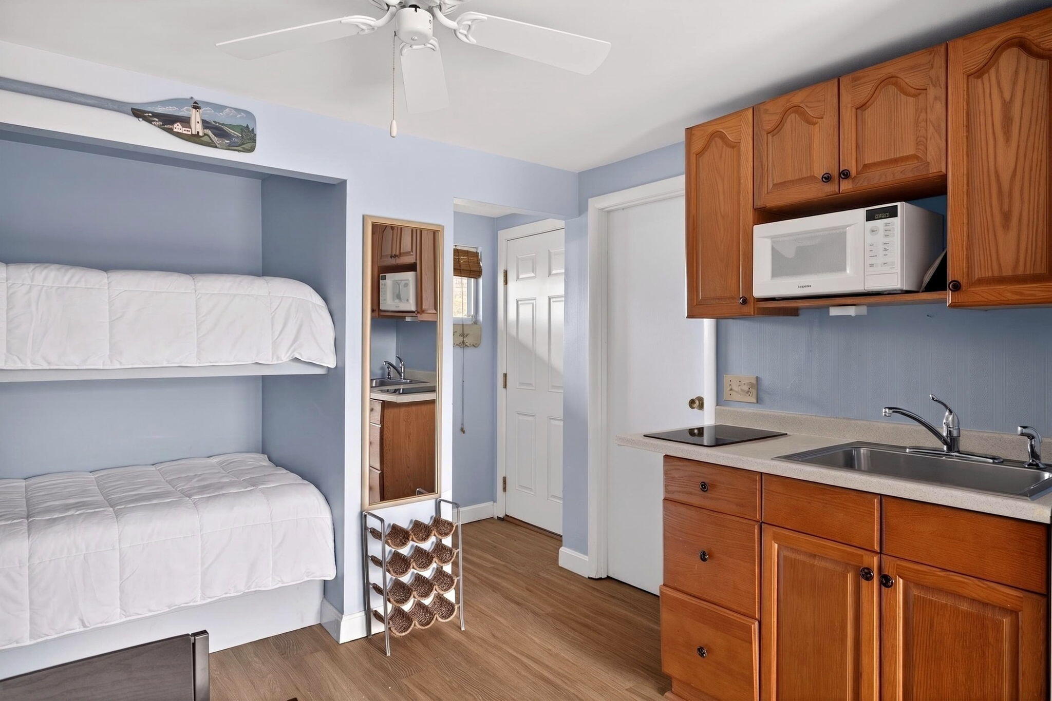 132 Shore Road, Unit 15 Truro, MA 02666 - Photo 10 of 33 a bedroom with a bed and a microwave