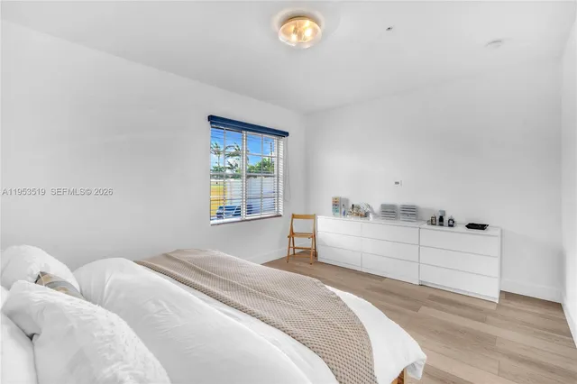 a room with a bed and a window