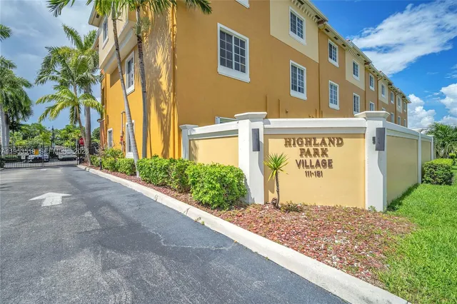 a sign board on the side of a building