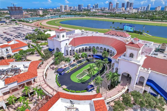 an aerial view of a house with a swimming pool yard and outdoor seating