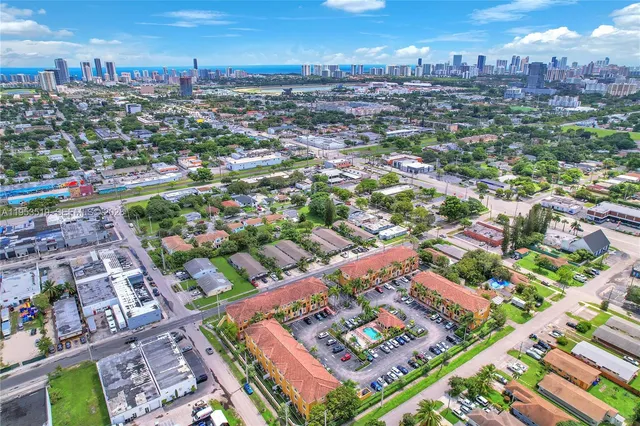 an aerial view of residential houses with outdoor space