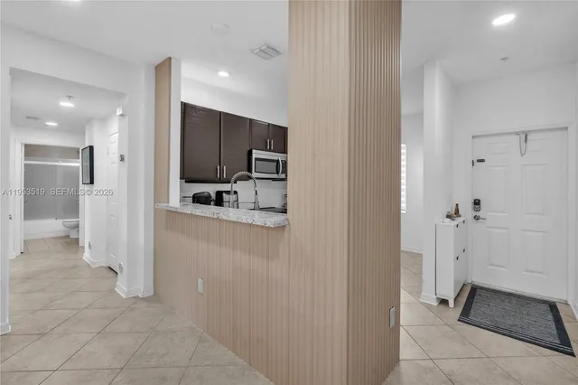a view of a hallway with a bathroom