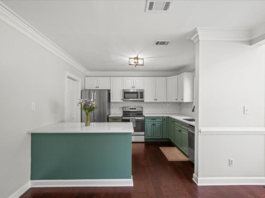 50 Mt Vernon Circle Atlanta, GA 30338 - Photo 12 of 28 a kitchen with a sink cabinets and wooden floor