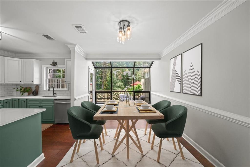 50 Mt Vernon Circle Atlanta, GA 30338 - Photo 14 of 28 a dining room with furniture a chandelier and wooden floor