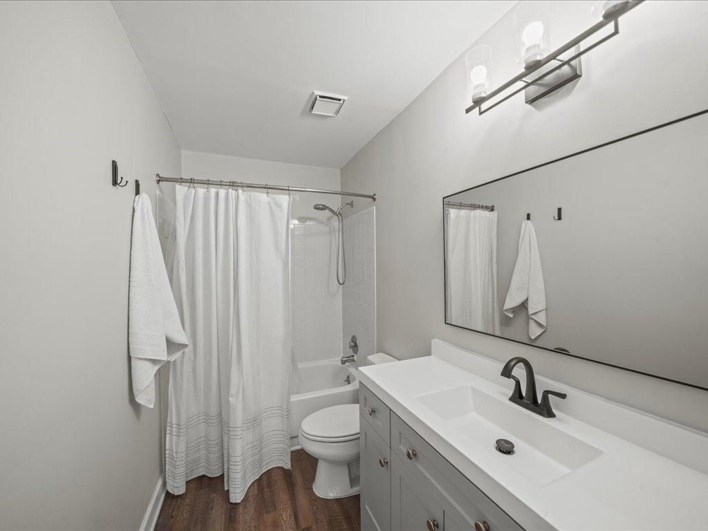 50 Mt Vernon Circle Atlanta, GA 30338 - Photo 21 of 28 a bathroom with a sink a toilet and a mirror