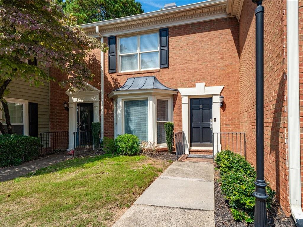 50 Mt Vernon Circle Atlanta, GA 30338 - Photo 3 of 28 a front view of a house with garden