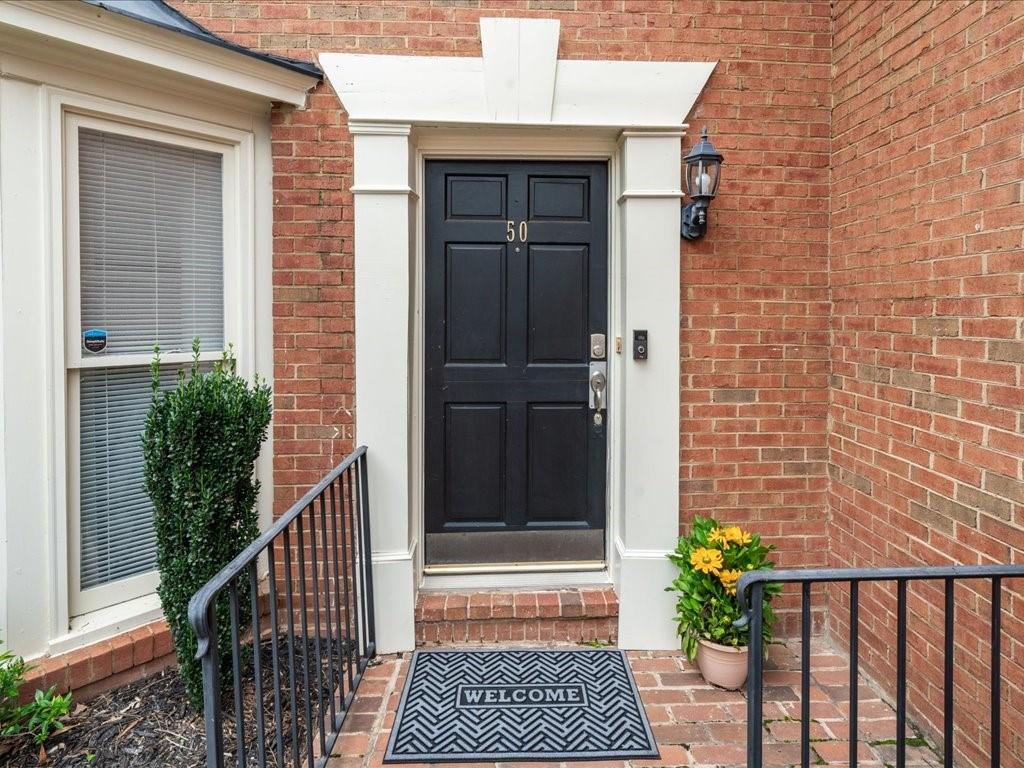 50 Mt Vernon Circle Atlanta, GA 30338 - Photo 4 of 28 a view of a house with wooden door and potted plants