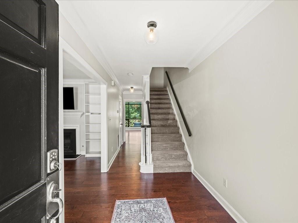 50 Mt Vernon Circle Atlanta, GA 30338 - Photo 5 of 28 a view of a hallway with wooden floor and staircase
