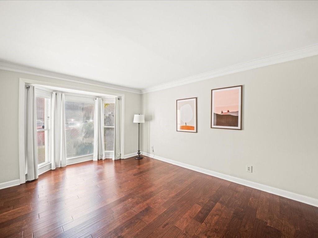 50 Mt Vernon Circle Atlanta, GA 30338 - Photo 7 of 28 a view of an empty room with wooden floor and a window