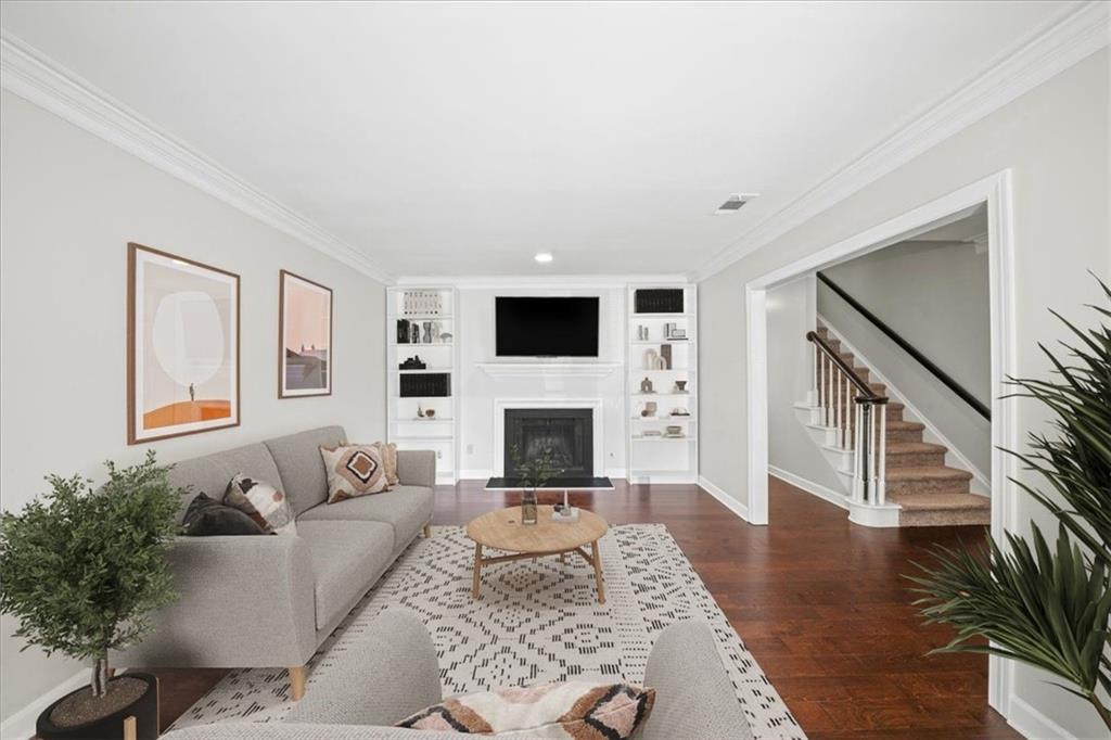 50 Mt Vernon Circle Atlanta, GA 30338 - Photo 8 of 28 a living room with furniture a fireplace and a flat screen tv