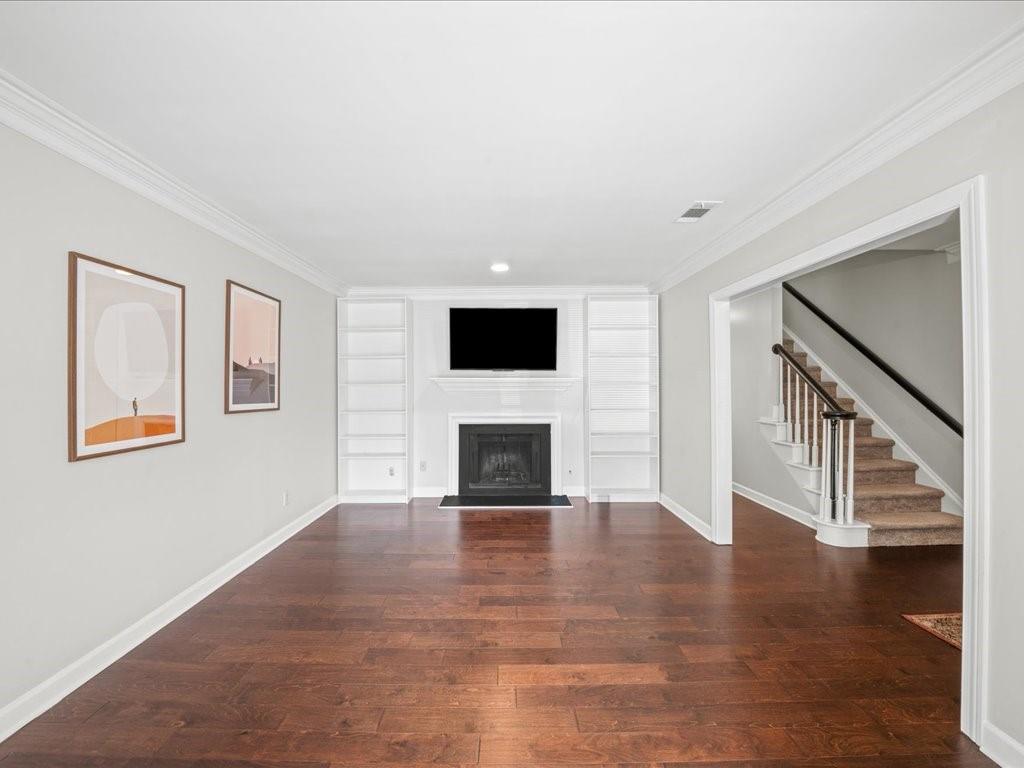 50 Mt Vernon Circle Atlanta, GA 30338 - Photo 9 of 28 a view of a livingroom with wooden floor and a fireplace