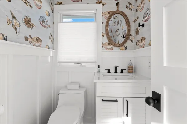 a bathroom with a toilet and a sink