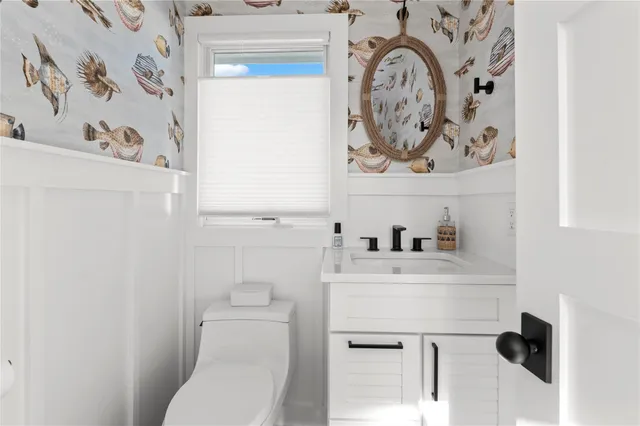 a bathroom with a toilet and a sink