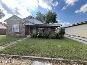 52 South Pleasant Street Decaturville, TN 38329 - Photo 11 of 46 a front view of a house with garden