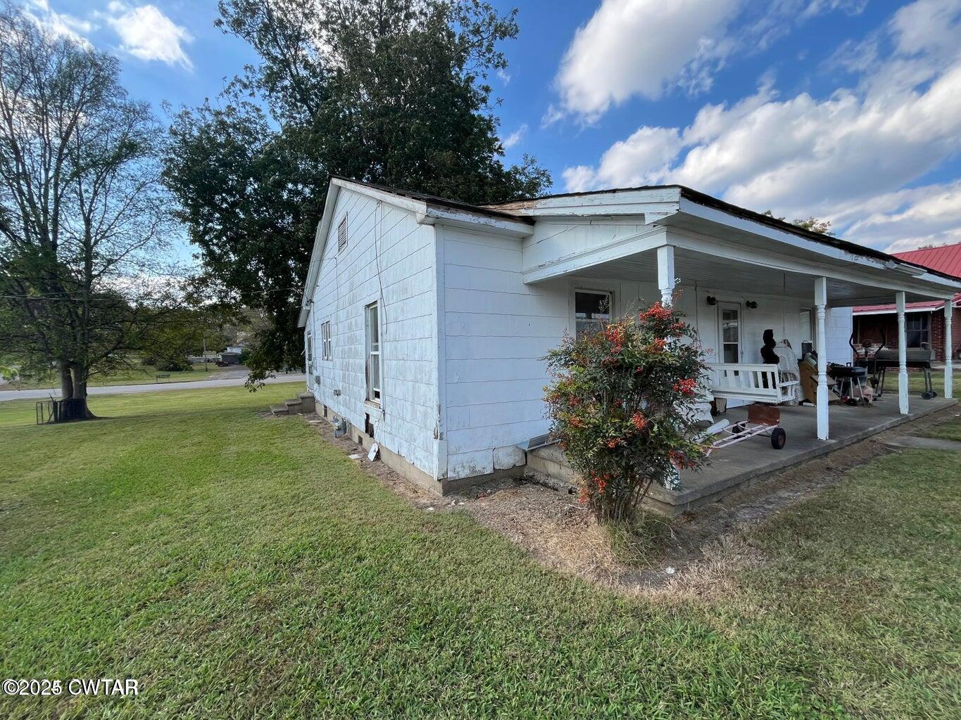 52 South Pleasant Street Decaturville, TN 38329 - Photo 24 of 46 a view of a house with backyard and garden