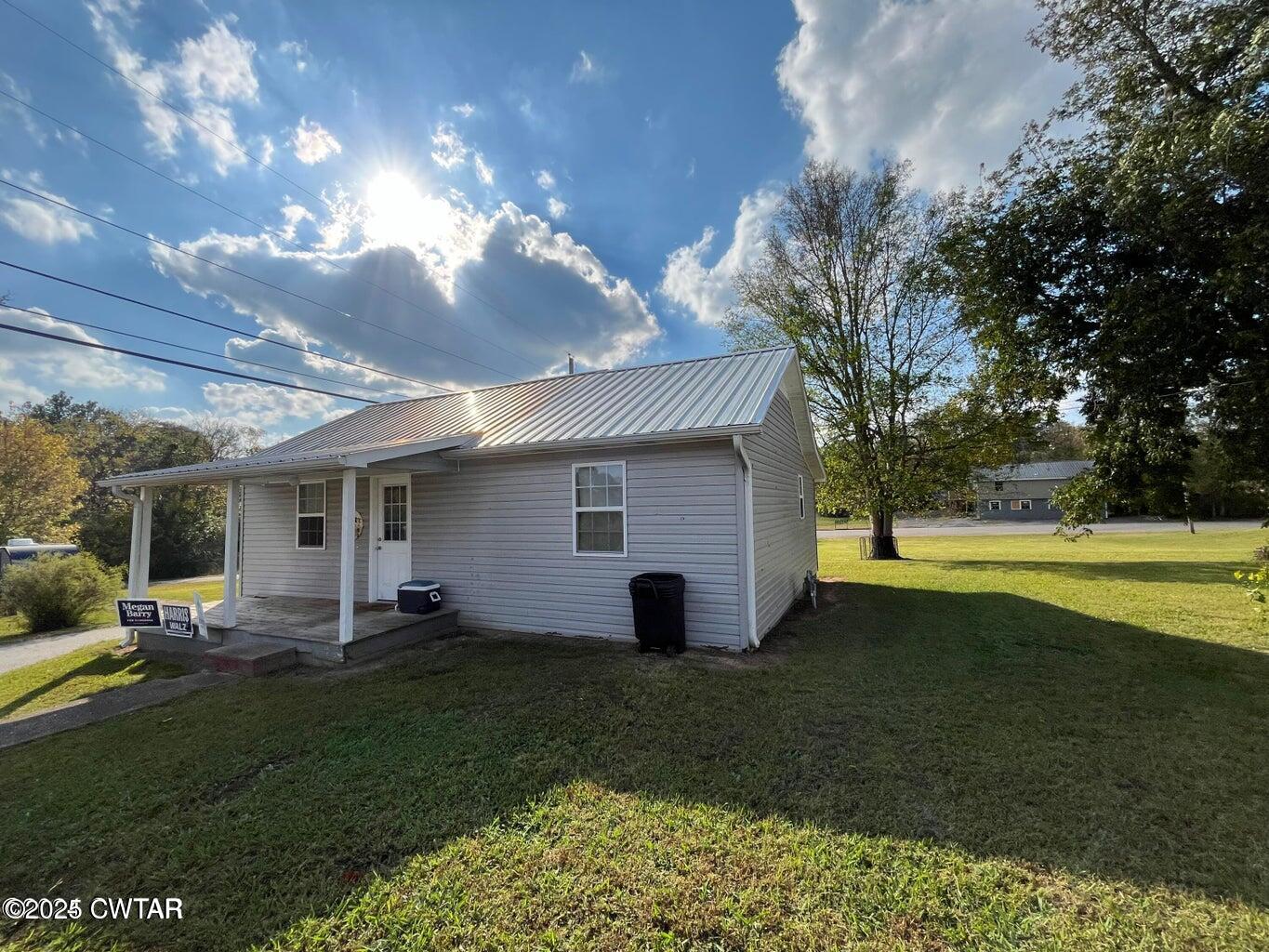 52 South Pleasant Street Decaturville, TN 38329 - Photo 25 of 46 a view of a house with backyard and garden