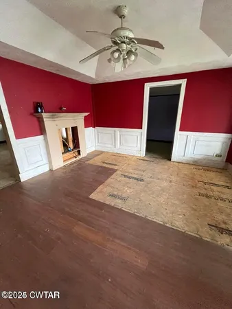 a view of a bedroom with a large bed and chandelier
