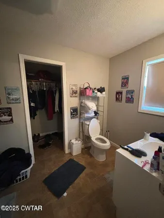 a room with a chair and white walls