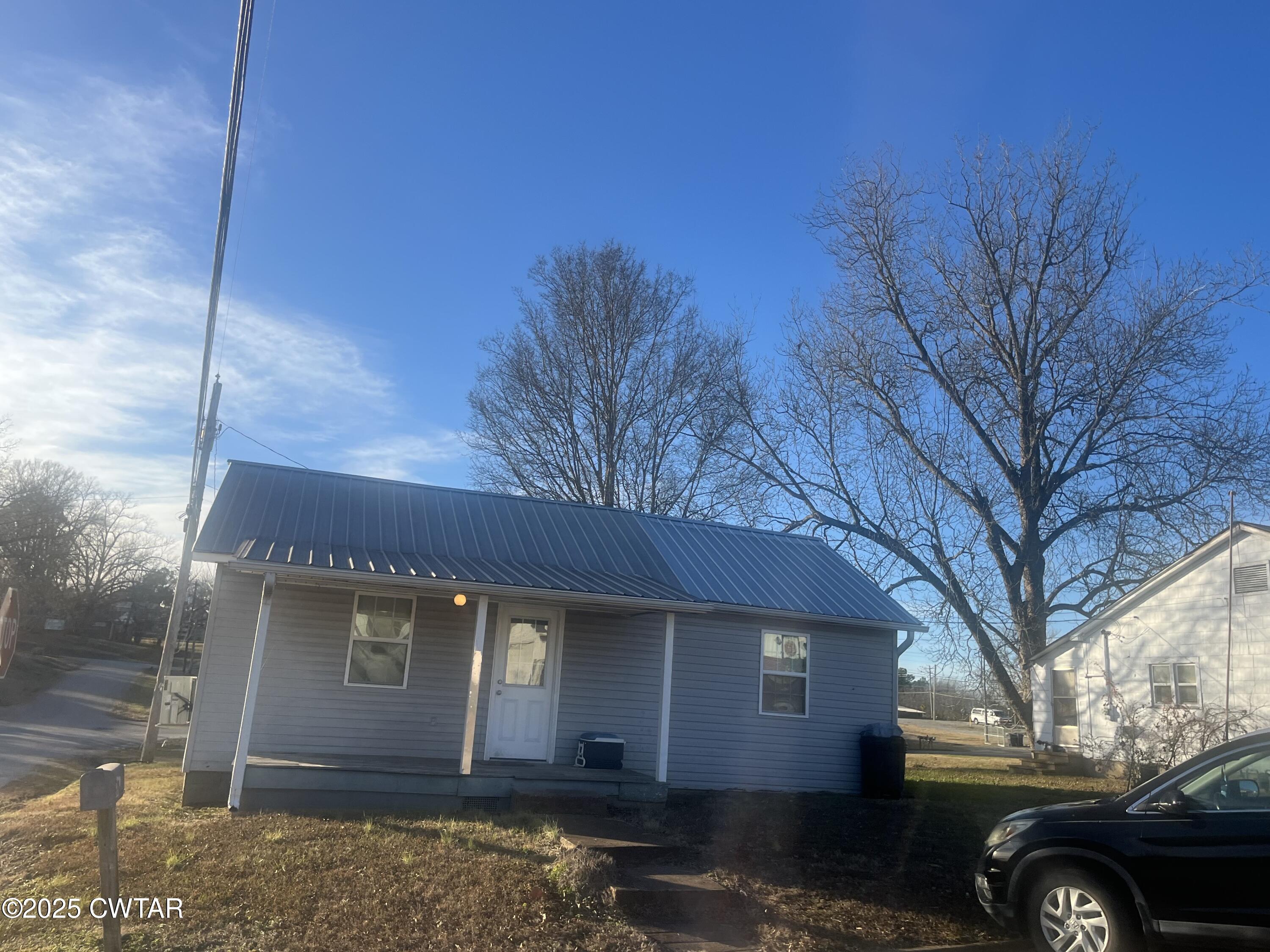 52 South Pleasant Street Decaturville, TN 38329 - Photo 39 of 46 a view of a house with a yard