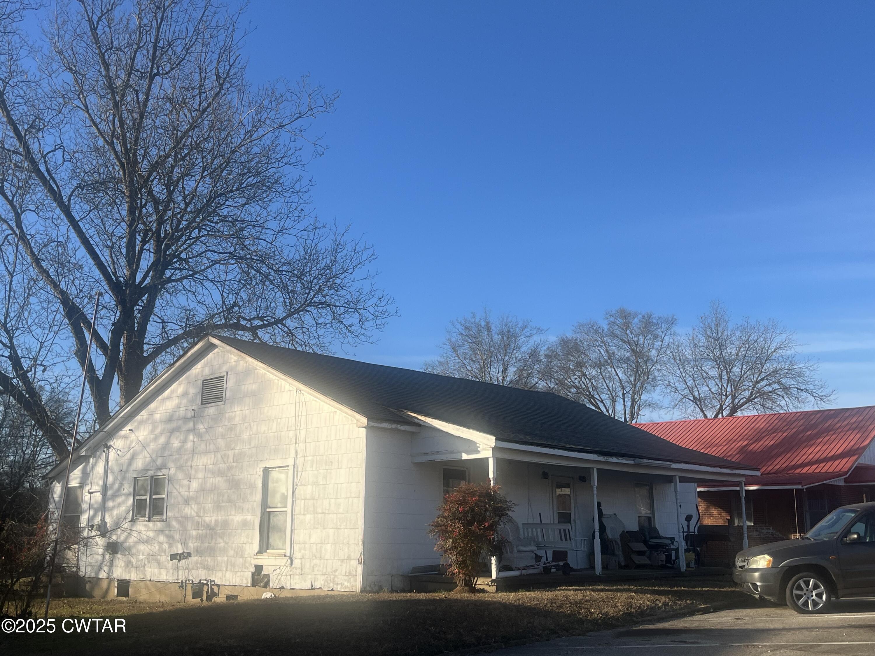 52 South Pleasant Street Decaturville, TN 38329 - Photo 40 of 46 a view of a building with car parked