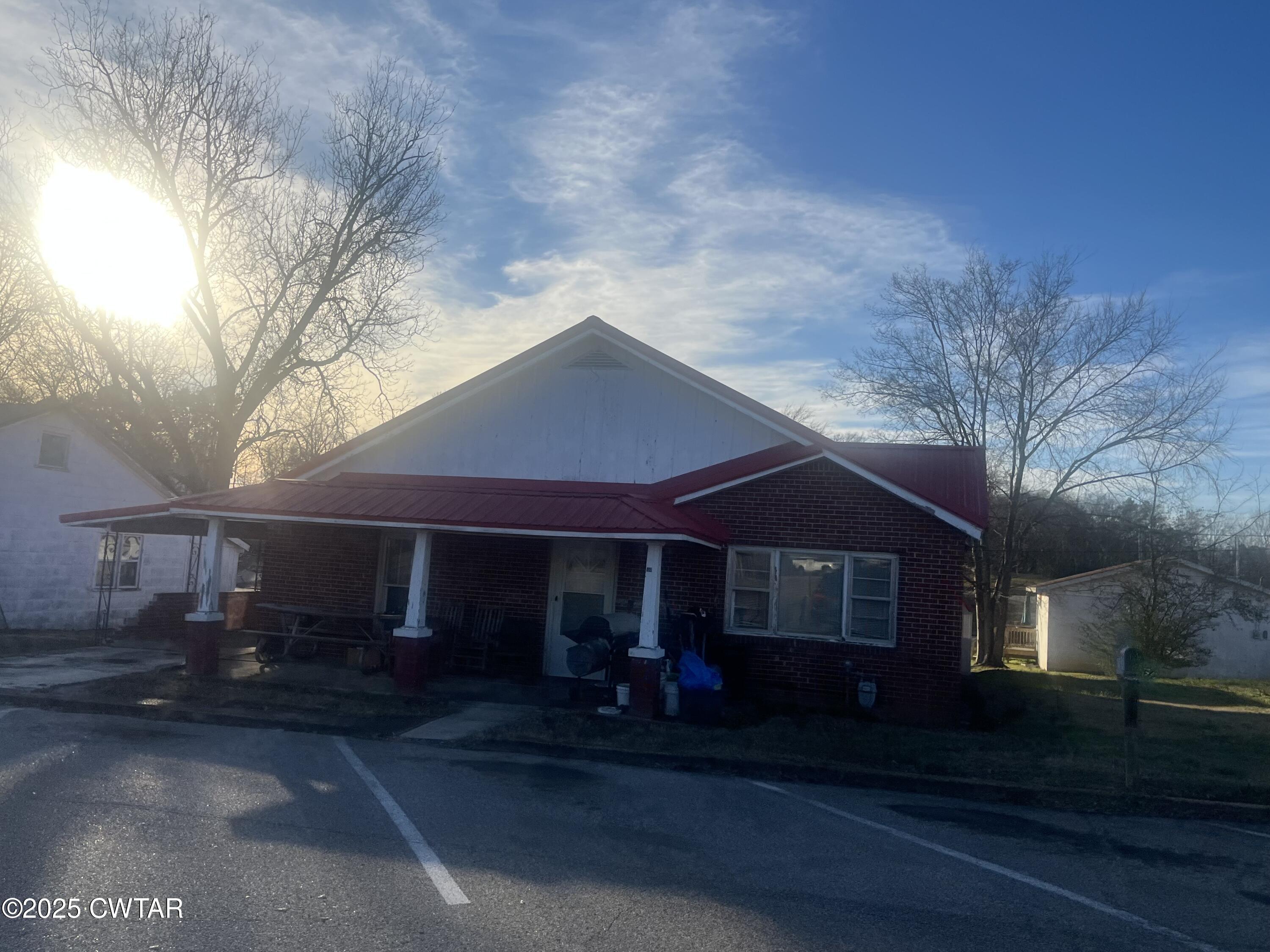 52 South Pleasant Street Decaturville, TN 38329 - Photo 43 of 46 a front view of a house with a yard