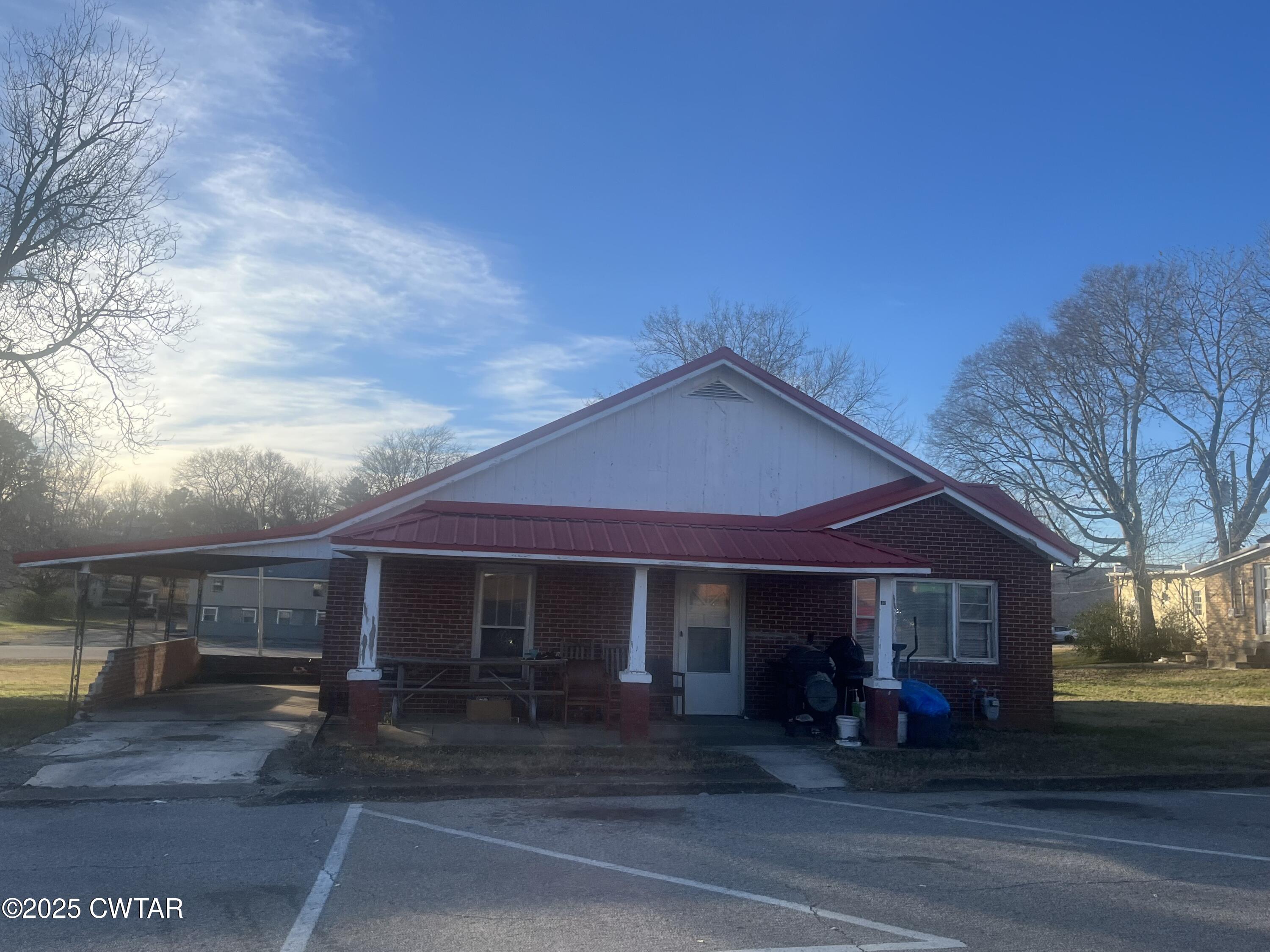 52 South Pleasant Street Decaturville, TN 38329 - Photo 45 of 46 a front view of a house with sitting area