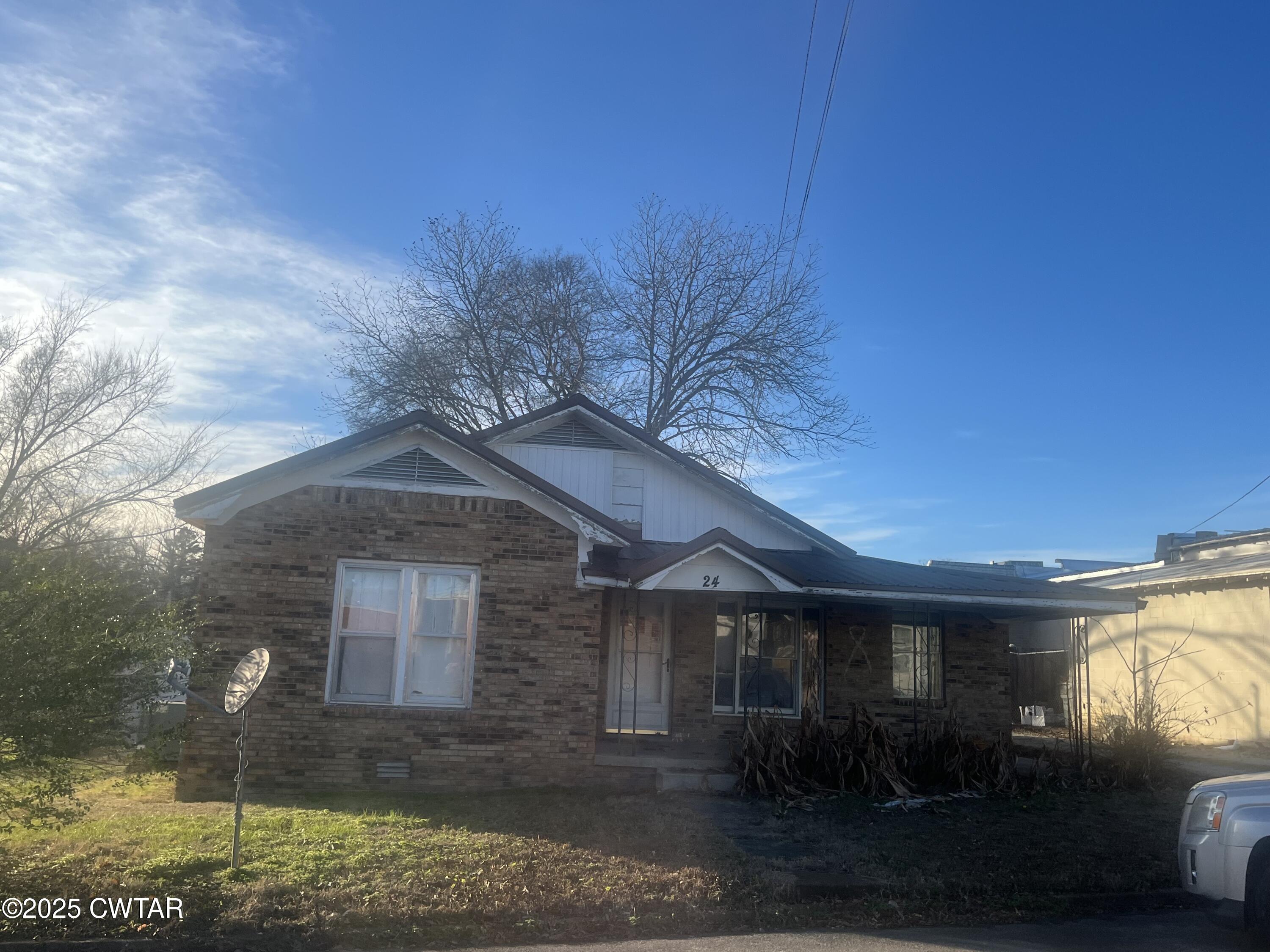 52 South Pleasant Street Decaturville, TN 38329 - Photo 46 of 46 a front view of a house with garden