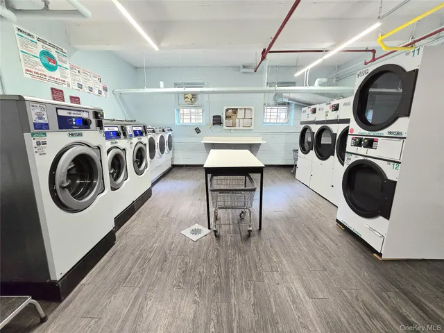 a view of parking area with lots of cars parked