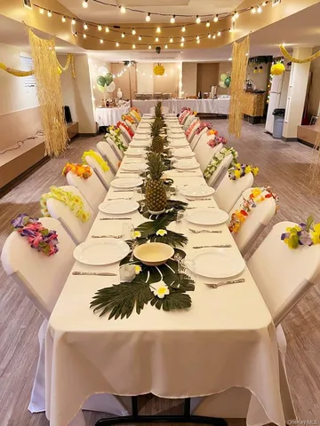a dining room with lots of furniture and garden view