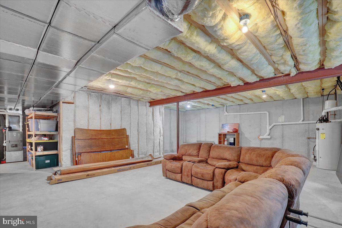 661 Integrity Drive Lititz, PA 17543 - Photo 32 of 37 a living room with furniture and a chandelier