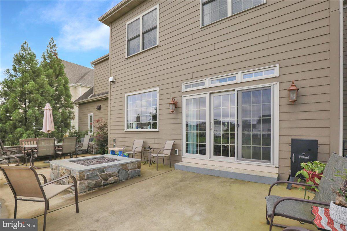 661 Integrity Drive Lititz, PA 17543 - Photo 36 of 37 a view of a patio with couches table and chairs and potted plants